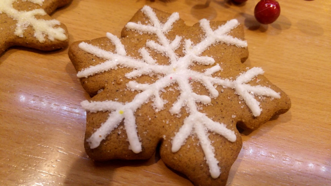 Cookie decorated with white royal icing and sugar